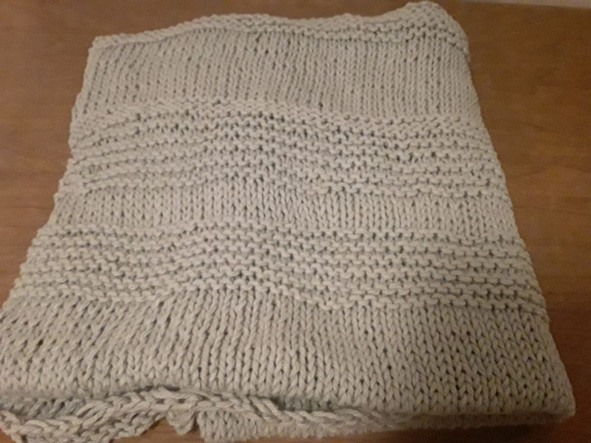 Warm knit blanket for a truck sleeper cab