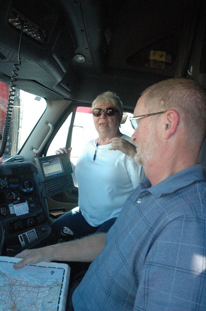 A long-haul driving team inside the truck cab.
